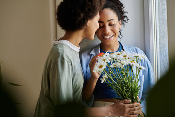 Happy African American couple enjoying quality time in their modern apartment together