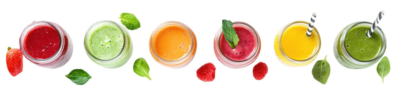 A array of colorful smoothies in glass jars. a variety of fruits and vegetables. arranged neatly on a white background. perfect for healthy lifestyle promotions
