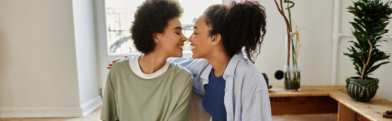 Happy African American couple sharing joyful moments in their cozy apartment