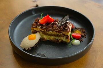 A slice of Tiramisu cake on plate. Classic Italian Dessert, ideal for food blogger or food...