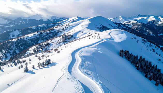Aerial view of snow-covered mountain slopes with ski tracks