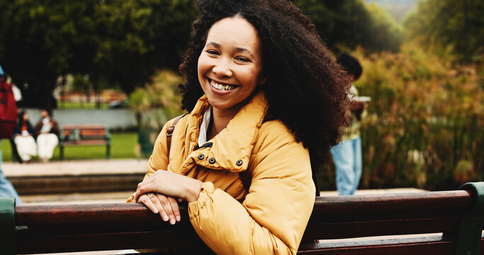 Portrait, woman and student on bench at college for education, scholarship and learning. Happy, female person and backpack outdoor of study opportunity, course curriculum and knowledge at university