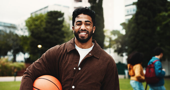 Portrait, student and happy man with basketball at college, sports scholarship and education. Smile, university and person with ball at campus outdoor for learning, development and athlete bursary