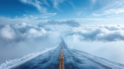 A paved road winding through a breathtaking landscape of snowy mountains and clouds.