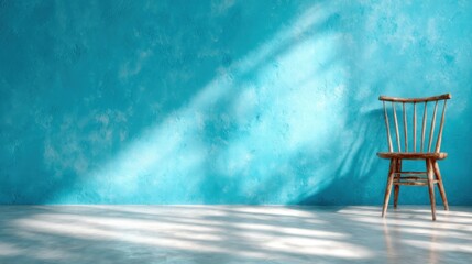 A minimalistic scene features a rustic wooden chair against a textured blue wall, creating a tranquil space that invites contemplation and appreciation of simplicity and design.