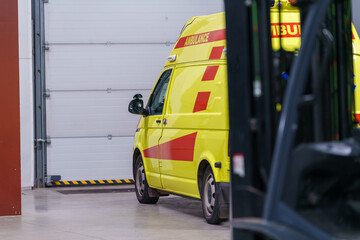 Naklejka premium Ambulance vehicle positioned inside the venue, prepared for emergency response during the event