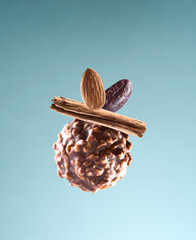 Nuts truffle with nuts on mint background