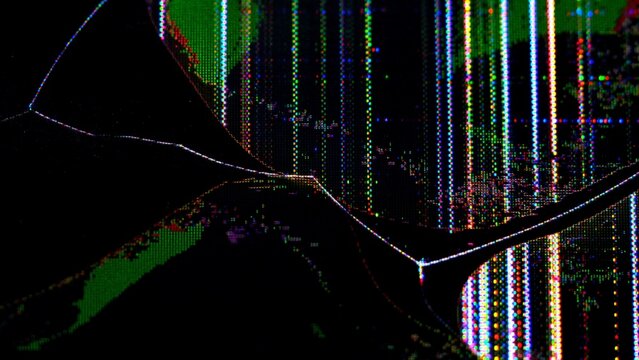 Close up of a broken TV screen displaying colorful pixel distortion and crack lines from impact.