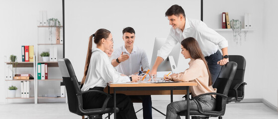 Business people negotiating at table in conference hall