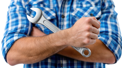 The Mechanic: A skilled mechanic, standing confidently with arms crossed, firmly grips a gleaming wrench, ready for any challenge in the workplace.