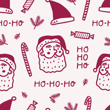 Seamless pattern with cute santa claus faces and ho ho ho lettering. 