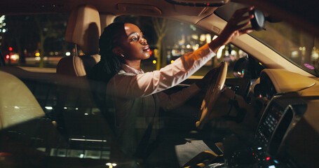 Night, rearview mirror or black woman in car with check, business commute or travel in urban area. Inspection, journey or girl in vehicle with evening trip, transportation or city drive after work.