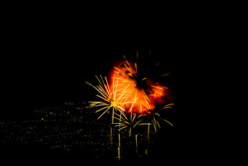 Fototapeta premium Fireworks lighting up the night sky. Pyrotechnics, abstract 