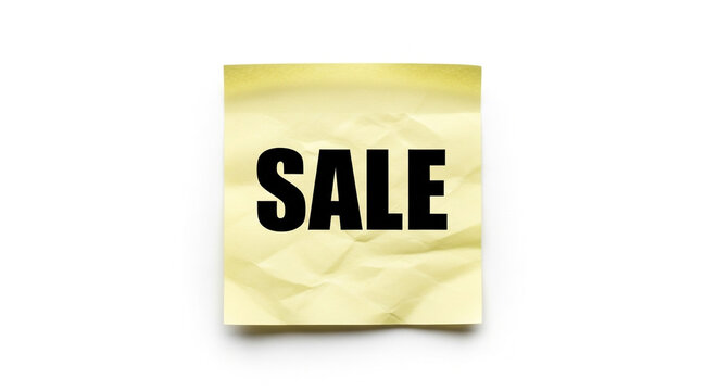 Bold black text SALE on crumpled yellow note paper announces exciting deals and promotions for shoppers seeking bargains