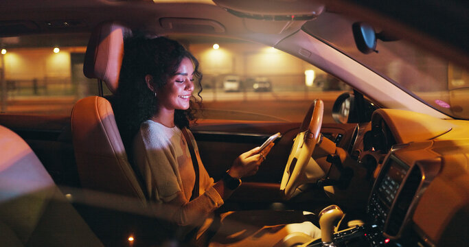 Business, night and phone with happy woman in car on city street for commute to destination. App, ride and smile with professional employee in vehicle for directions of drive in dark urban location