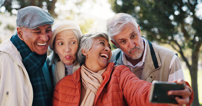 Senior friends, selfie and funny face at park for happy memory, tongue out or group laugh together. Profile picture, elderly men and women outdoor for silly photo, social media update and retirement