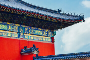 Beautiful imperial palace at Temple of Heaven (Tiantan) with traditional Chinese roof and blue glazed tiles under blue sky in summer in Beijing, China