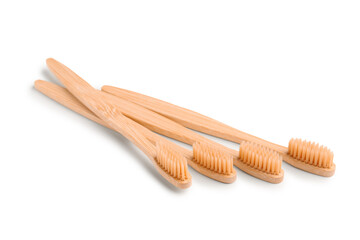 Many bamboo toothbrushes on white background
