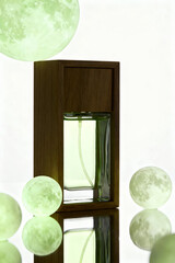 Bottle of unisex green eau de toilette, scented with green tea, on a white background