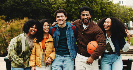 Portrait, friends or college student with hug on campus, education support or outdoor bonding on study break. Embrace, diversity and happy people laugh together, care and knowledge with basketball
