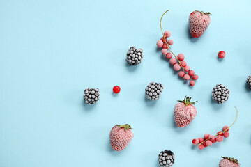 Frozen berries on blue background
