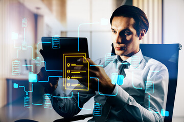 Businessman using tablet with digital document management system and neon data network connections in modern office background.