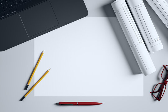 Minimalist architecture workspace with blank paper, rolled blueprints, pencils, laptop corner, and red glasses on light background. 3D Rendering