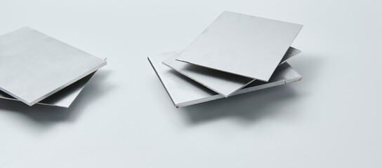 Metal surface sheets with brushed and matte finishes, showcasing industrial texture and modern...