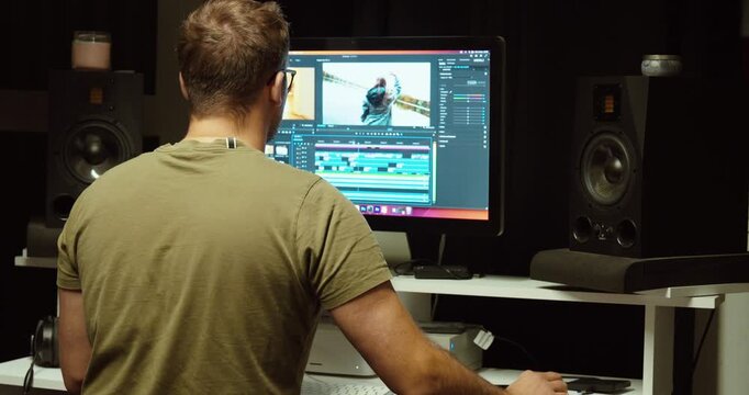 A professional video editor works on a project in Adobe Premiere Pro. Concept of creativity, post-production, color grading, and filmmaking workflow.