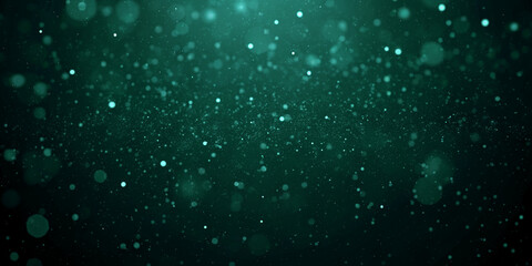 Green luminous particles floating in air, soft elegant background with glowing abstract motion.