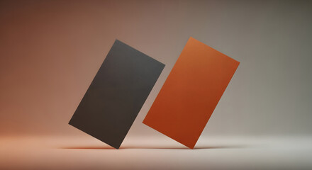 Dual Cards: Two rectangular cards lean against a neutral backdrop, bathed in a warm light that emphasizes their texture and form. The contrast in color creates a visual focal point.