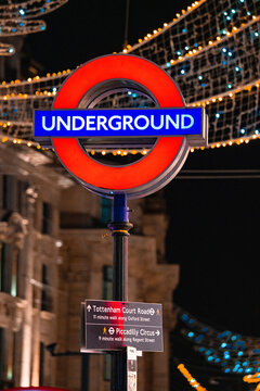 British Tube Station Sign, TfL Roundel Logo, Regent Street Christmas Lights, Tottenham Court Road, Piccadilly Circus Directional Wayfinding Post, London Underground Symbol, UK &mdash; 10 November 2025