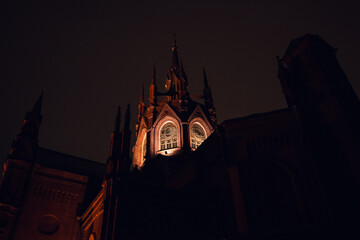 Illuminated Gothic Facade Detail at Night in Moscow