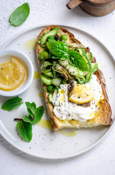 Bruschetta with spring vegetables burrata and lemon confit