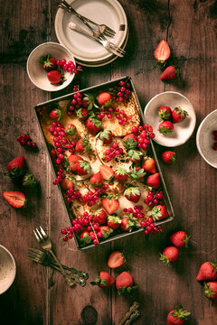 fresh pancakes in baking tin on wood