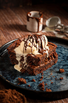 Portion of brownies with ice cream