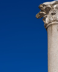 Classical architcture. Ancient roman column and capital (with blue sky and copy space)