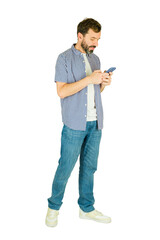 Full length view of a man standing using smartphone texting communicating on mobile device
