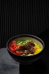 Poke bowl with chicken, tofu, yuuyama and vegetables isolated for menu