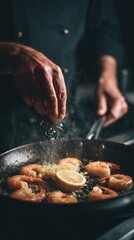 Professional chef adding spices to delicious shrimp and lemon in a hot pan.
