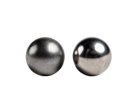 Spherical Harmony: A pair of perfectly polished spheres sit side-by-side, their surfaces reflecting the world around them in a dance of light and shadow, highlighting precision and perfect form.