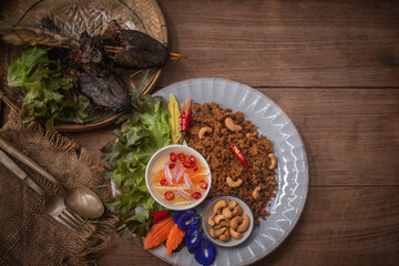 Fried catfish spicy salad, Asian Thai cuisine food. Serve with sweet and sour spicy sauce.