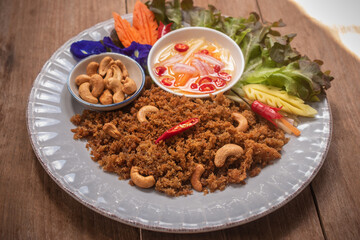 Fried catfish spicy salad, Asian Thai cuisine food. Serve with sweet and sour spicy sauce