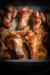Homemade dried chicken wings on a silver tray