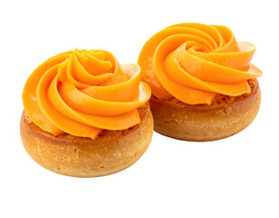 Two mini cakes, golden brown bases topped with vibrant orange swirl frosting