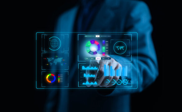 Businessman using futuristic digital dashboard interface with data analytics, graphs, and global network visualization. Concept of big data, business intelligence, and technology innovation.