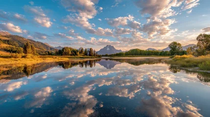Poster Reflectie A lone cloud in a blue sky reflected in Oxbow Bend at dawn  © VolumeThings