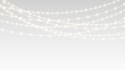 Garland decorated with festive lights ribbons and glowing bulbs on christmas holiday stage.
