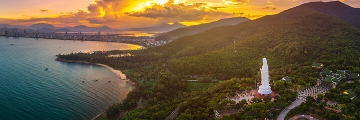 Panoramic Aerial View Of Lady Buddha Statue And Da Nang Coastline At Sunset