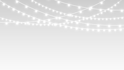 Garland festive glowing christmas bulbs and ribbons across decoration stage.
